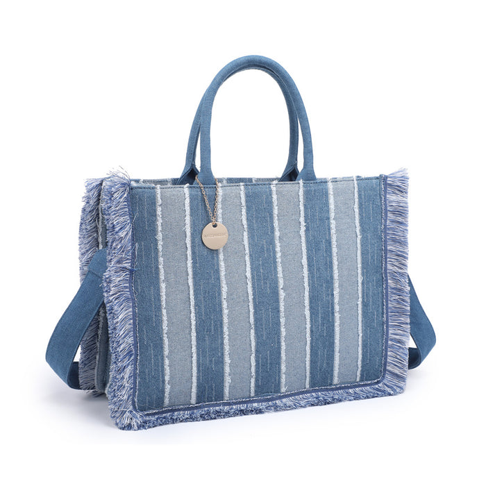 Striped denim tote bag with fringe trim and structured silhouette wholesale