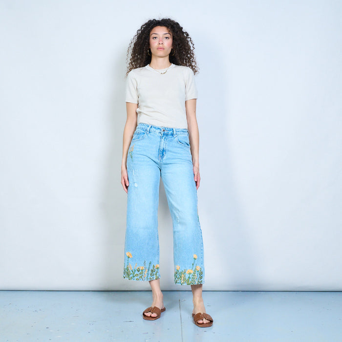 Beaded floral hem statement denim trousers with distressed details wholesale