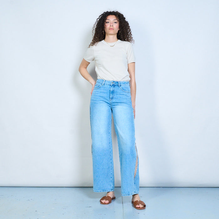 Light wash denim jeans with side slit beaded mesh panel wholesale