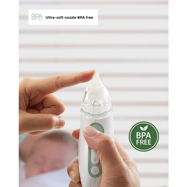 Momcozy Nasal Aspirator held in hands showing soft nozzle tip, white and green device, text reads "Ultra-soft nozzle BPA Free" on white background.