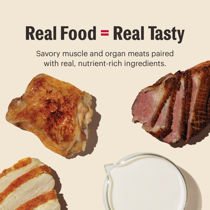 Overhead view of cooked meats and a glass of milk with text: “Real Food = Real Tasty. Savory muscle and organ meats, goat’s milk, and real nutrients in The Honest Kitchen Mousse Wet Cat Food Variety Pack.”.