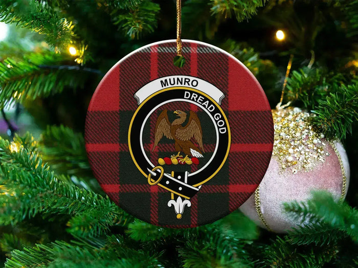 Munro Family Crest ceramic ornament hanging on a tree