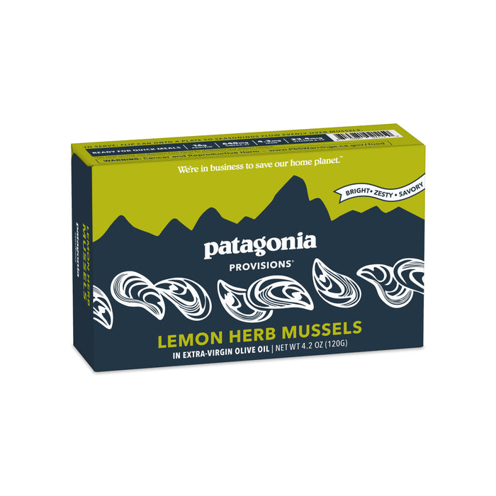 A box of Patagonia Provisions Mussels Lemon Herb in organic extra virgin olive oil, with green mountains, white mussel illustrations, and text describing the product as “bright, zesty, savory.”.