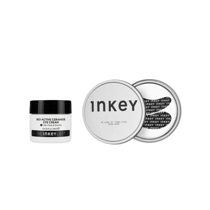 The Inkey Bio-Active Ceramide Eye Cream in a white jar with a black lid, shown next to a silver round tin displaying the product's packaging details on a solid white background.