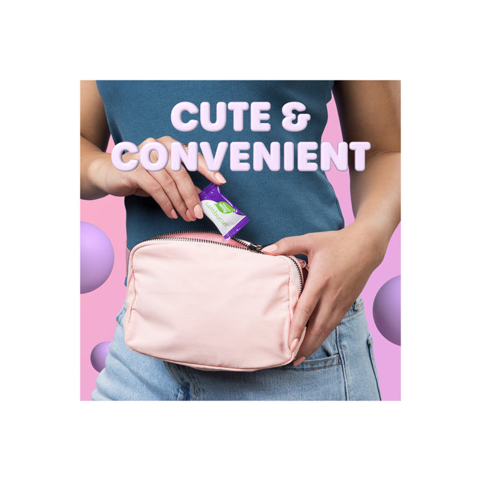 A person places a Sambucus Ultra Immune Juicy Burst by Natures Way into a light pink zippered pouch, with “CUTE & CONVENIENT” above, set against a pink background with floating purple spheres for immune support.