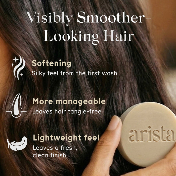 Arista shampoo bar held against hair with text highlighting hair care benefits