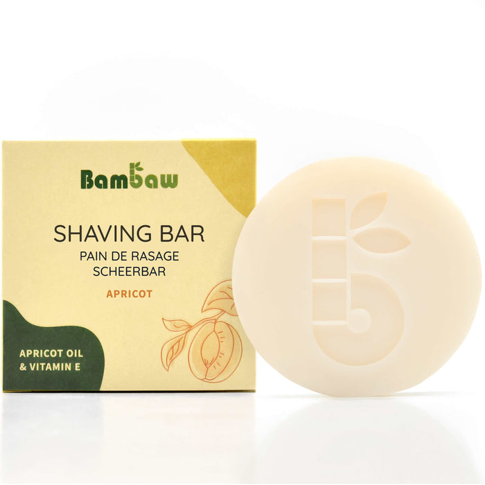 Shaving Bar packaging box labeled APRICOT OIL & VITAMIN E beside a pale soap