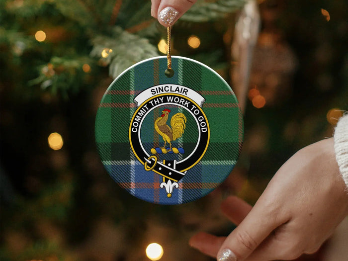 Sinclair Family Crest held beside Christmas decorations