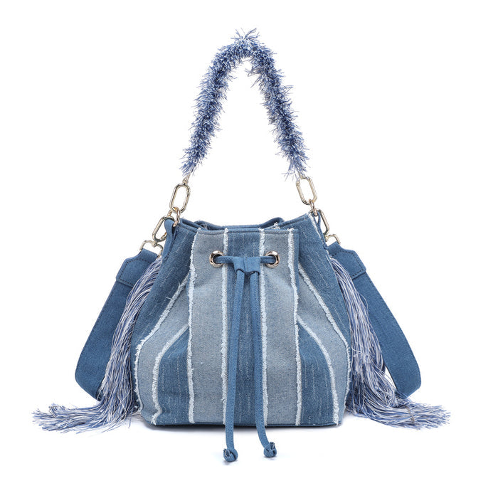 Striped denim patchwork bucket bag with fringe handle and tassel sides wholesale
