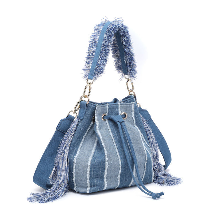 Striped denim patchwork bucket bag with fringe handle and tassel sides wholesale