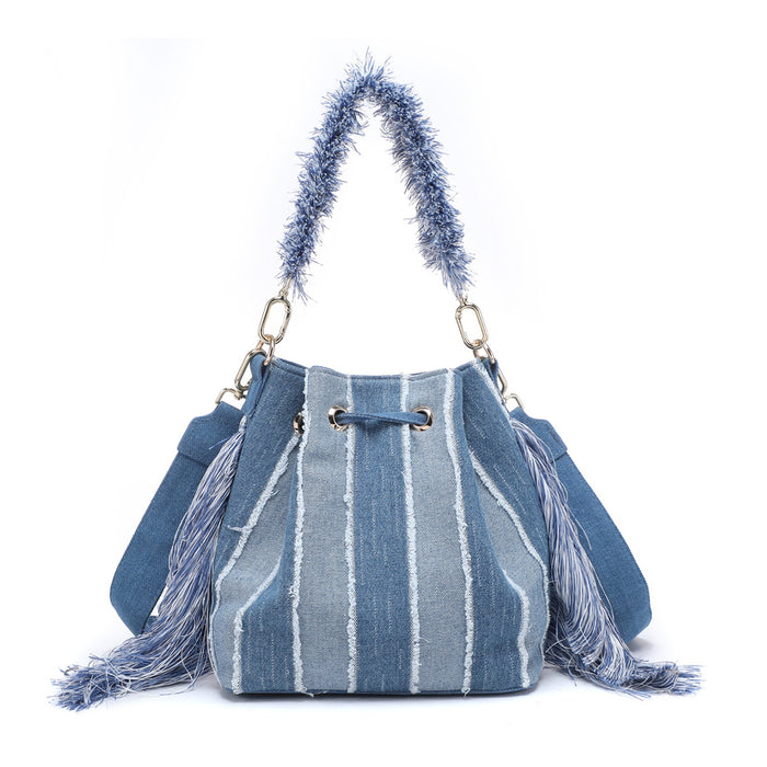 Striped denim patchwork bucket bag with fringe handle and tassel sides wholesale