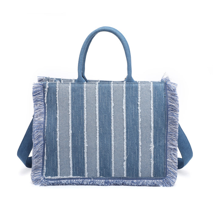 Striped denim tote bag with fringe trim and structured silhouette wholesale