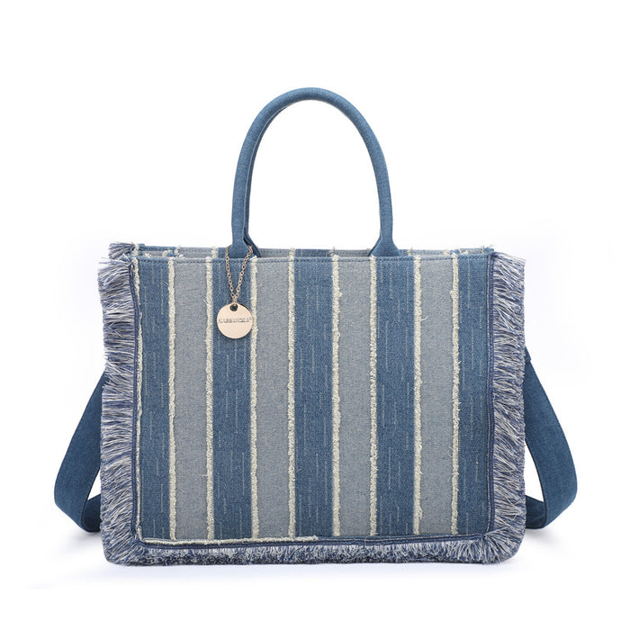 Striped denim tote bag with fringe trim and structured silhouette wholesale