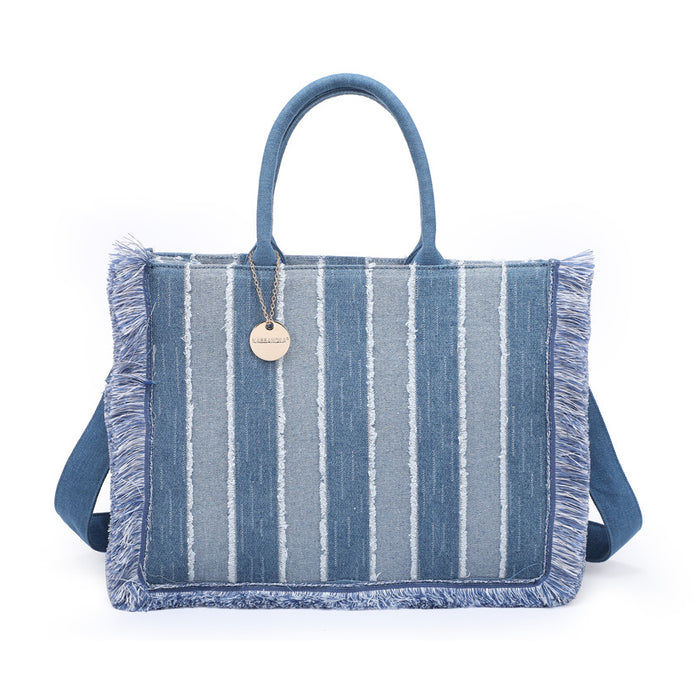Striped denim tote bag with fringe trim and structured silhouette wholesale