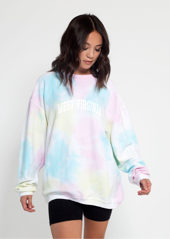 West Virginia Mountaineers Unisex Rainbow-Tie-Dye Oversized Premium cotton corded fleece Sweatshirt with Super soft hand feel, vintage wash and ribbed crew neckline, cuffs, and hemline