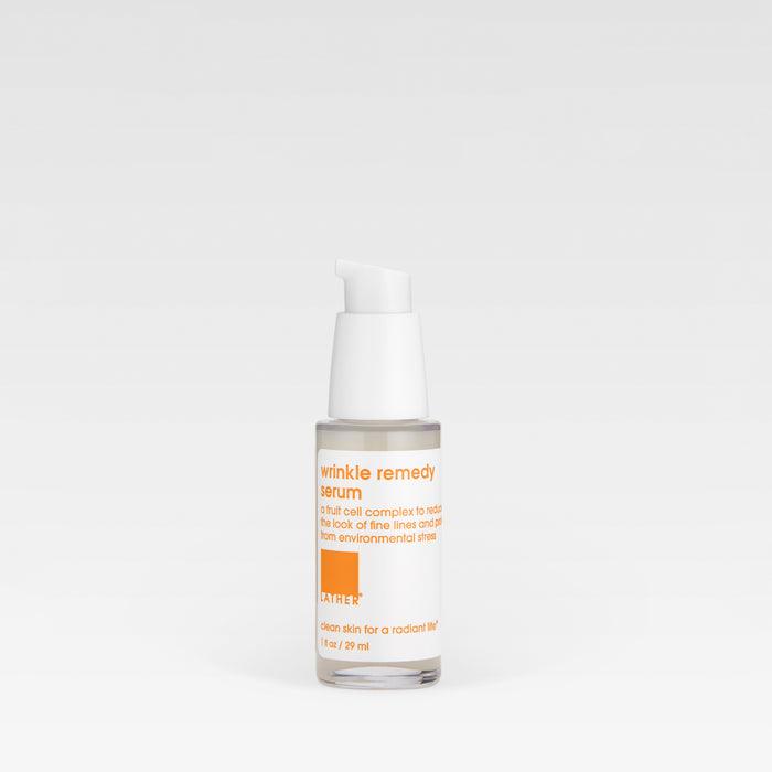 A clear plastic bottle with a white pump dispenser containing the Wrinkle Remedy Serum, with a label that includes the product name and the brand.