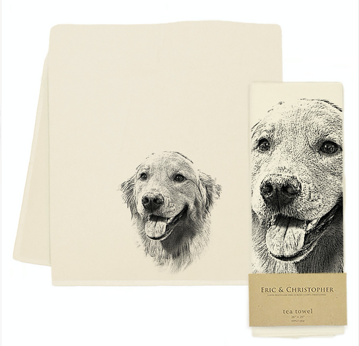 A set of two flour sack kitchen towels with a screen printed image of a labrador retriever in the center, one showing the dog's head and the other showing the dog with a decorative bow.
